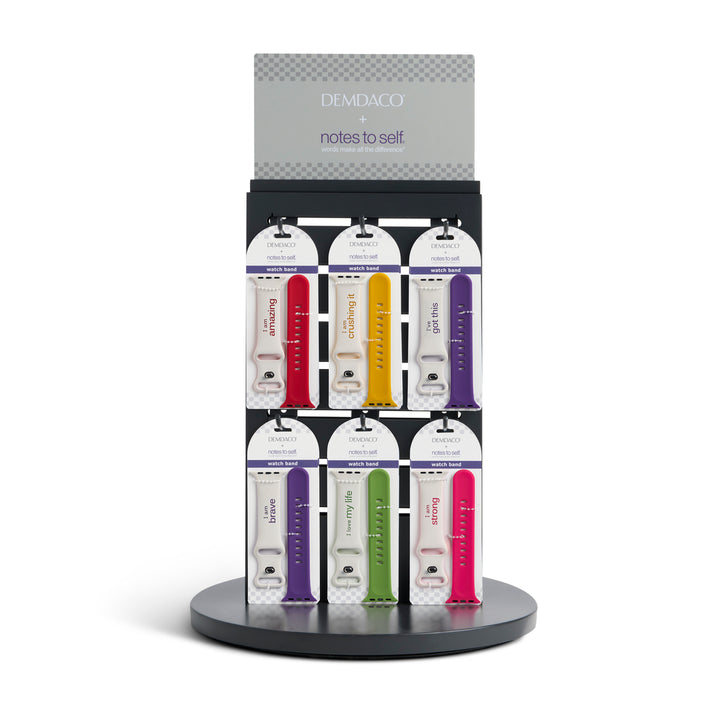 Display of Demdaco 'notes to self' colorful watch bands on a white background