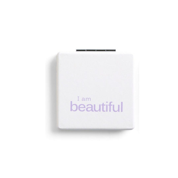 White pocket mirror with 'I am beautiful' text