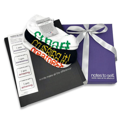 graduation sock, sticker, and notebook set in a purple  box