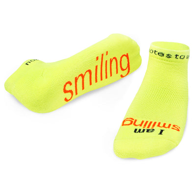 i am smiling neon yellow socks with positive message